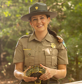 park ranger with a turtle